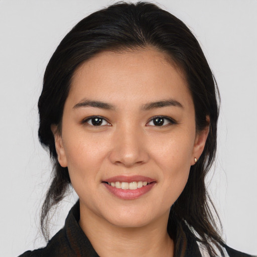 Joyful white young-adult female with medium  brown hair and brown eyes