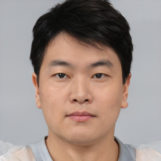 Neutral asian young-adult male with short  brown hair and brown eyes