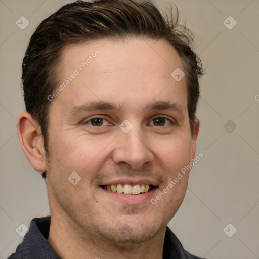 Joyful white adult male with short  brown hair and brown eyes