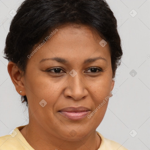 Joyful latino adult female with short  brown hair and brown eyes