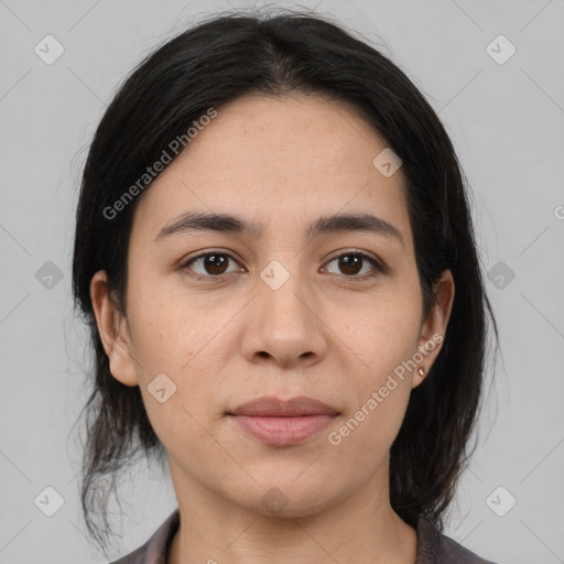 Joyful latino young-adult female with medium  brown hair and brown eyes