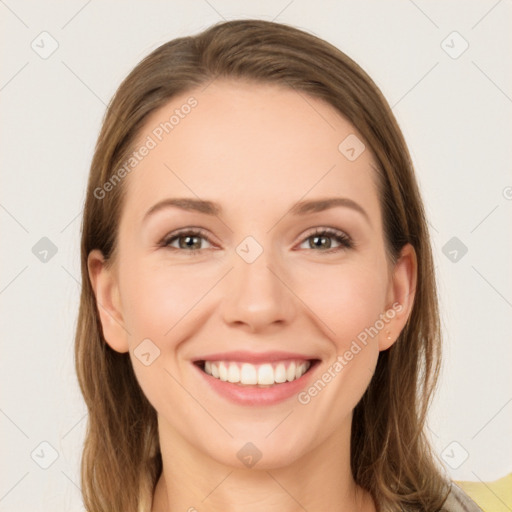 Joyful white young-adult female with long  brown hair and green eyes