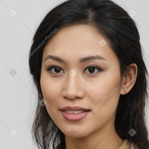 Joyful asian young-adult female with long  brown hair and brown eyes