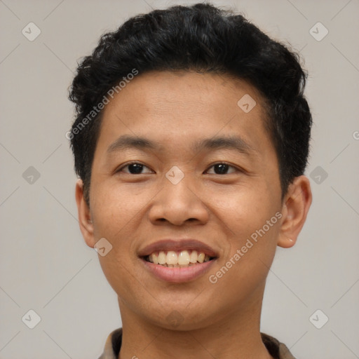 Joyful asian young-adult male with short  brown hair and brown eyes