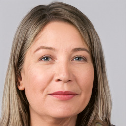 Joyful white adult female with long  brown hair and grey eyes