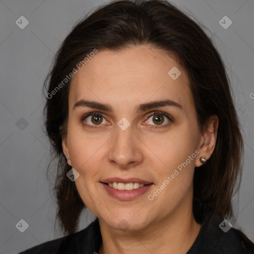 Joyful white adult female with medium  brown hair and brown eyes