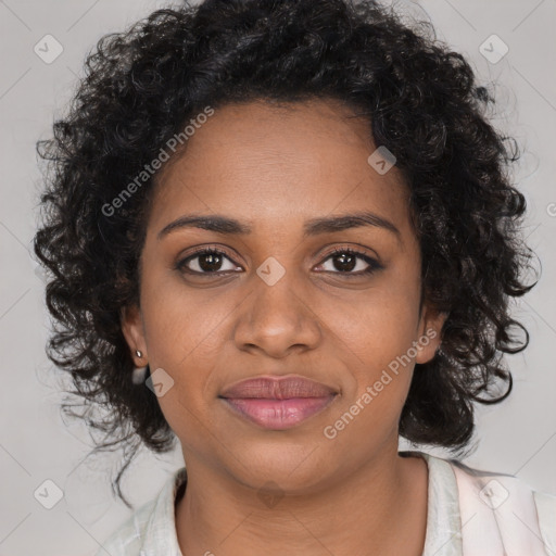 Joyful black young-adult female with long  brown hair and brown eyes