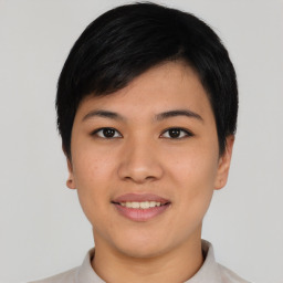 Joyful asian young-adult female with short  black hair and brown eyes