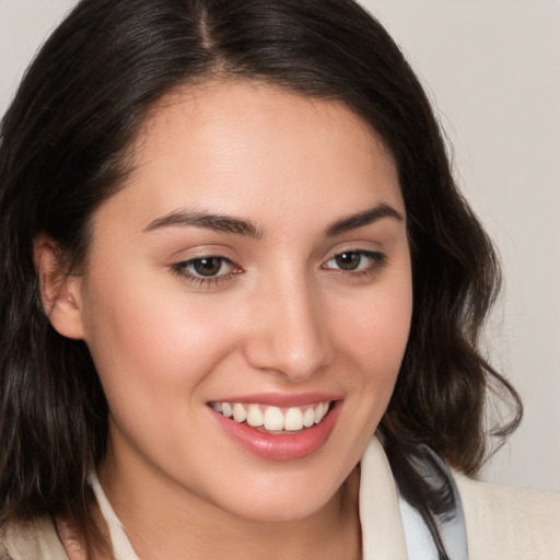 Joyful white young-adult female with medium  brown hair and brown eyes