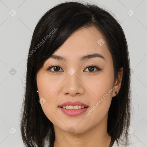 Joyful asian young-adult female with long  brown hair and brown eyes