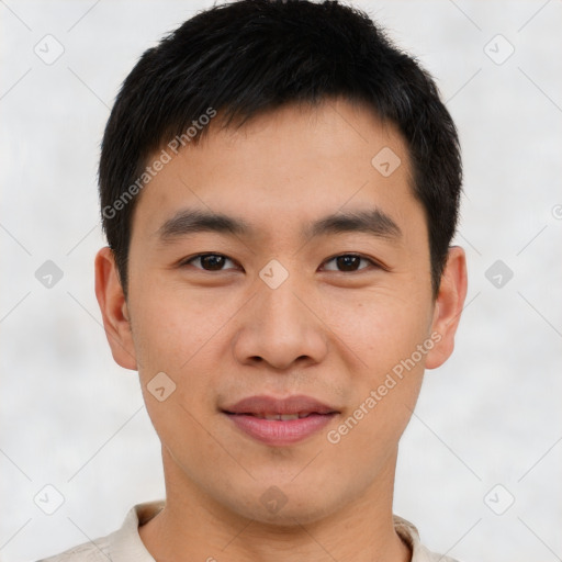 Joyful asian young-adult male with short  brown hair and brown eyes