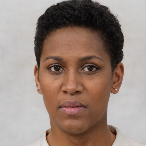 Neutral black young-adult female with short  brown hair and brown eyes