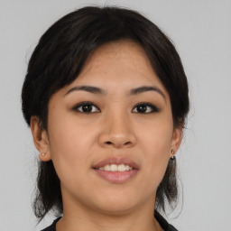 Joyful asian young-adult female with medium  black hair and brown eyes