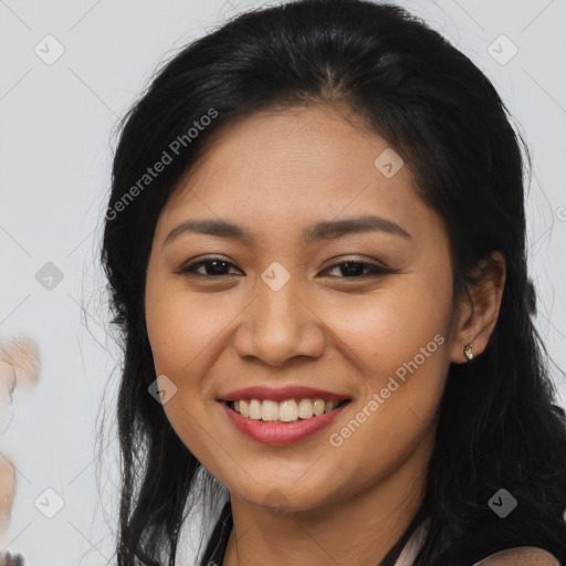 Joyful asian young-adult female with long  brown hair and brown eyes