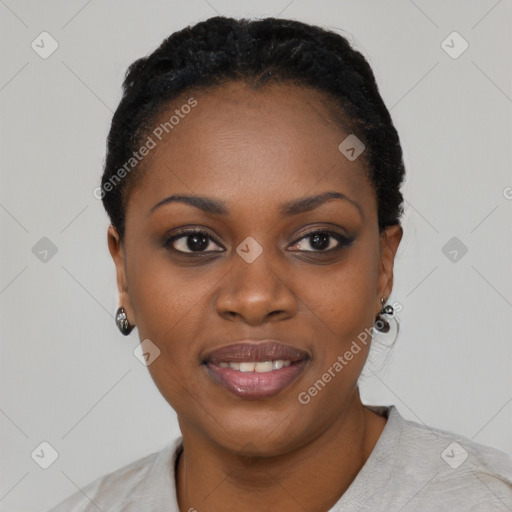 Joyful black young-adult female with short  black hair and brown eyes