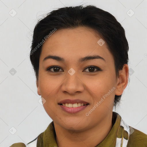 Joyful latino young-adult female with short  brown hair and brown eyes