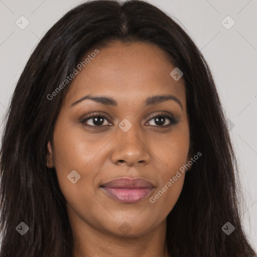 Joyful black young-adult female with long  brown hair and brown eyes