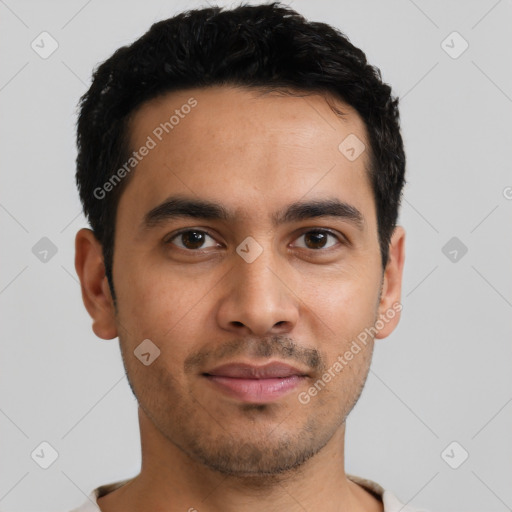 Joyful latino young-adult male with short  brown hair and brown eyes