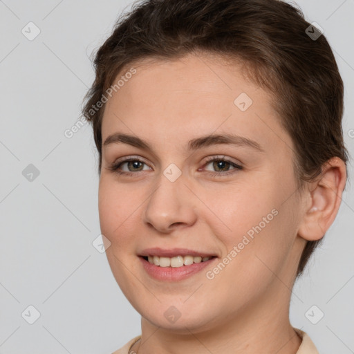 Joyful white young-adult female with short  brown hair and brown eyes