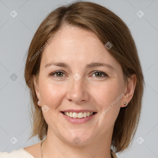 Joyful white adult female with medium  brown hair and grey eyes