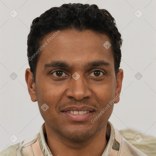 Joyful black young-adult male with short  brown hair and brown eyes