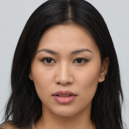 Joyful asian young-adult female with long  brown hair and brown eyes