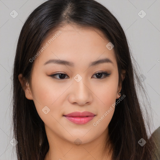 Joyful asian young-adult female with long  brown hair and brown eyes