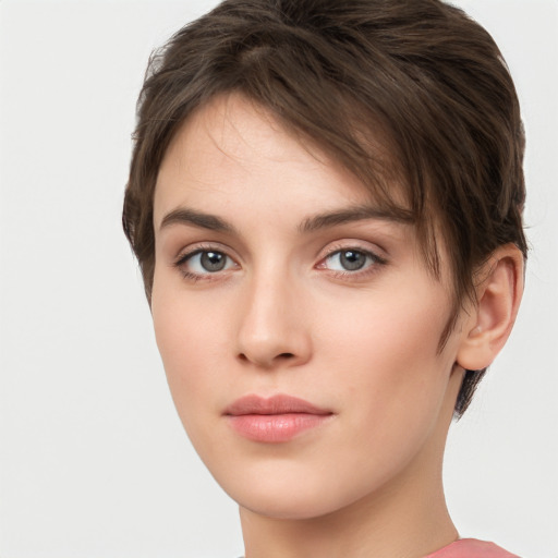 Neutral white young-adult female with short  brown hair and brown eyes