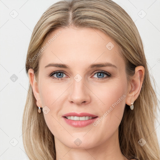 Joyful white young-adult female with long  brown hair and blue eyes