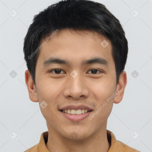 Joyful asian young-adult male with short  brown hair and brown eyes