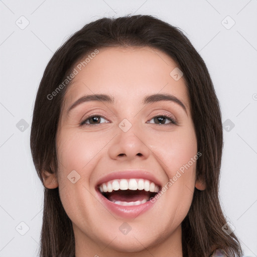 Joyful white young-adult female with long  brown hair and brown eyes