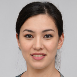 Joyful asian young-adult female with medium  brown hair and brown eyes