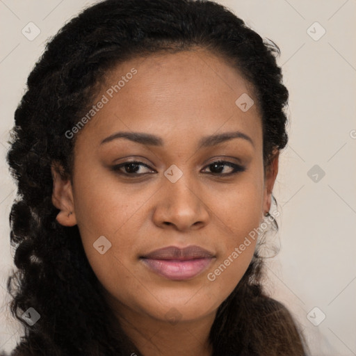 Joyful black young-adult female with long  brown hair and brown eyes