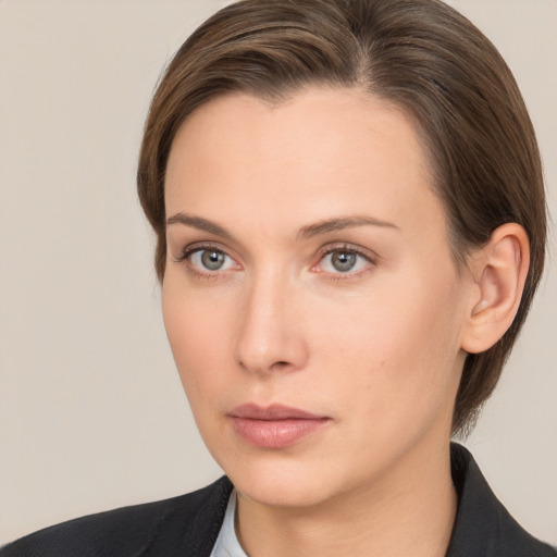 Neutral white young-adult female with medium  brown hair and brown eyes