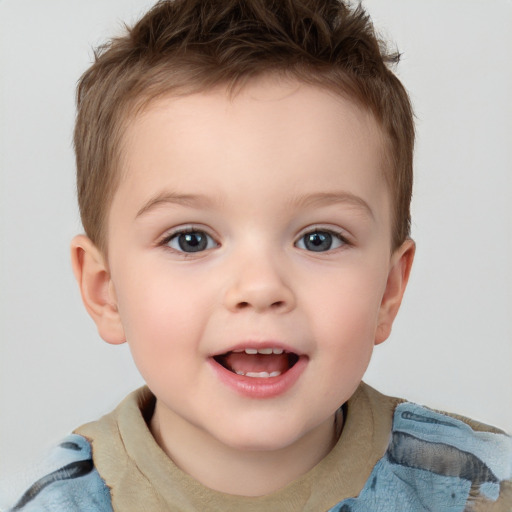 Joyful white child male with short  brown hair and grey eyes