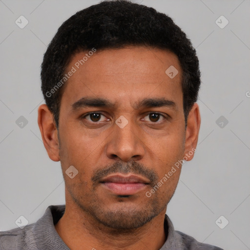Neutral latino young-adult male with short  black hair and brown eyes