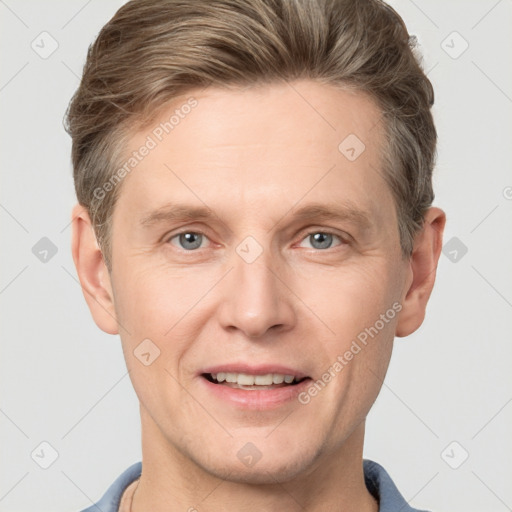 Joyful white adult male with short  brown hair and grey eyes