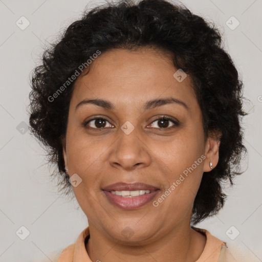 Joyful latino adult female with short  brown hair and brown eyes