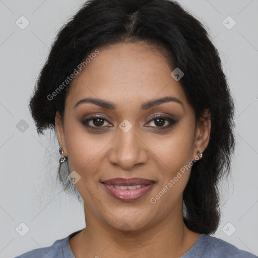 Joyful black adult female with medium  brown hair and brown eyes