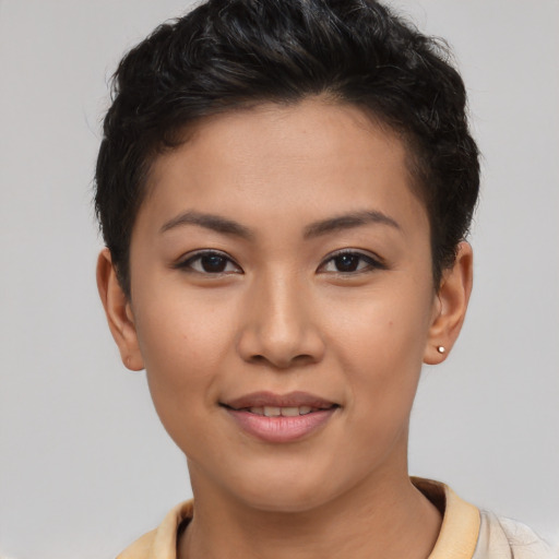Joyful latino young-adult female with short  brown hair and brown eyes
