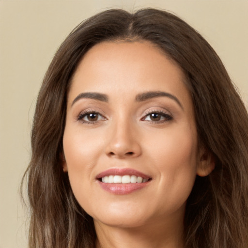 Joyful white young-adult female with long  brown hair and brown eyes