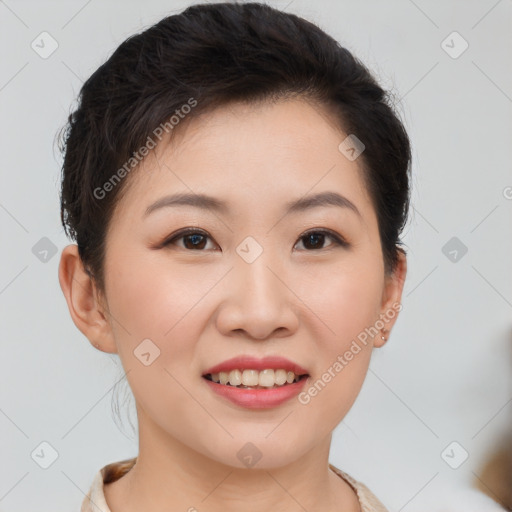 Joyful asian young-adult female with short  brown hair and brown eyes