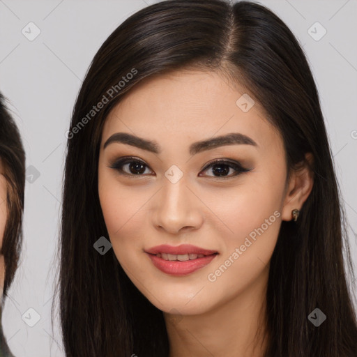 Joyful asian young-adult female with long  brown hair and brown eyes