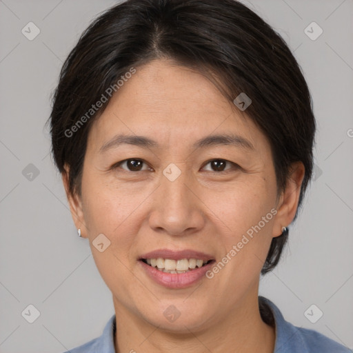 Joyful white adult female with medium  brown hair and brown eyes