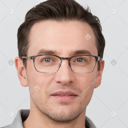 Joyful white adult male with short  brown hair and grey eyes