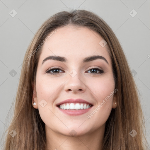 Joyful white young-adult female with long  brown hair and grey eyes