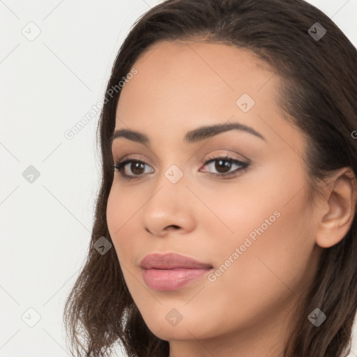 Joyful latino young-adult female with long  brown hair and brown eyes