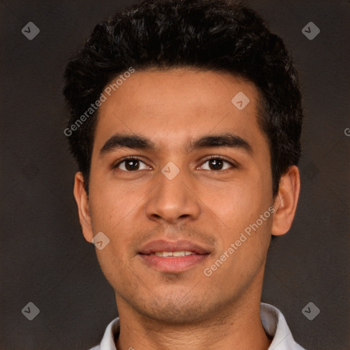 Joyful white young-adult male with short  black hair and brown eyes