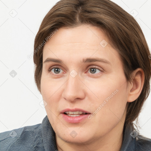 Joyful white adult female with medium  brown hair and grey eyes