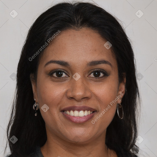 Joyful black young-adult female with long  brown hair and brown eyes